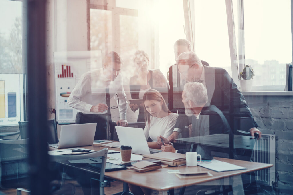 Professional,Business,Team,Discussing,New,Strategy,While,Working,Together,With