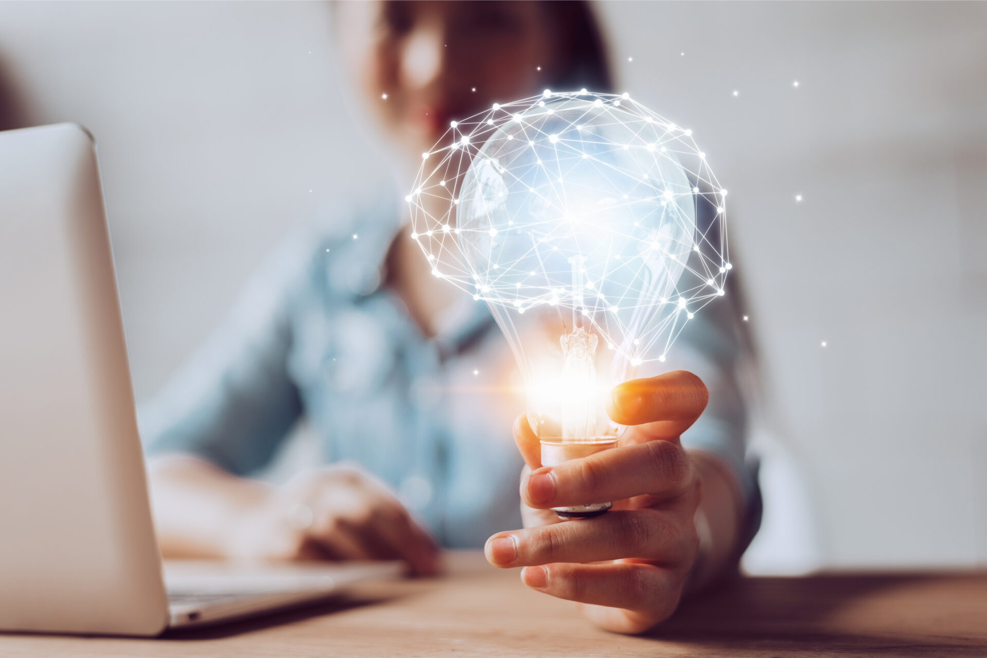 person holding lightbulb - innovation