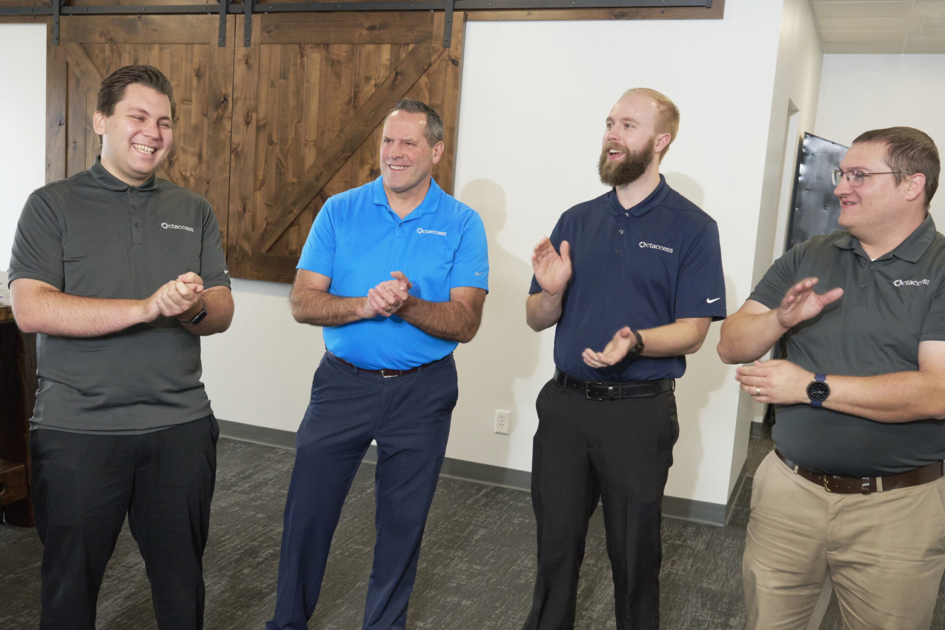Group of employees clapping