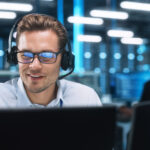 man in front of computer - tech priorities